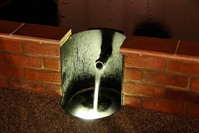 One of the water spouts lit up by an underwater spot